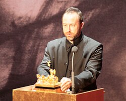 Jimmy Wales accepts the 2008 Quadriga A Mission of Enlightenment award on behalf of Wikipedia.