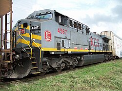 KCSM #4567, a GE AC4400CW from CPKC that still retains the gray Transportadora Ferroviaria Mexicana (TFM) scheme with the KCS de Mexico logos and lettering painted over where the TFM logos used to be