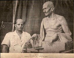 Indian sculptor Devi Prasad Roy Choudhury with his sculpture of Gandhi