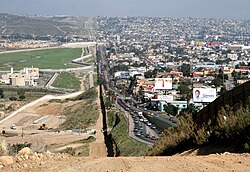 The Mexico–United States border wall between San Diego (left) and Tijuana (right)