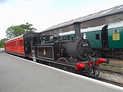 British Railways 0-6-0T Class A1X No. 32678 and a Birdcage Brake Coach at Tenterden Town recreating past scenes from the early 1950s on rural branch lines