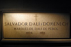 Dalí's crypt at the Dalí Theatre-Museum in Figueres displays his name and title.