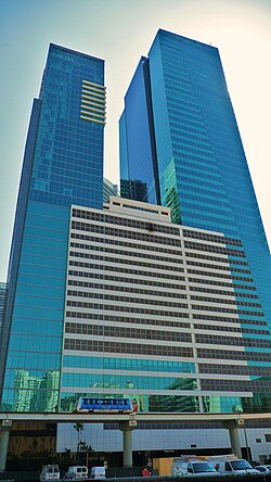 A large, mostly enclosed multi-storey car park forms the base or "pedestal" of two connected high rises. At nearly 20 stories and over 200 feet (61 m), it is an exceptionally large car park that comprises a significant portion of the building.
