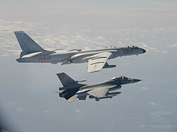 A Taiwanese F-16 fighter jet flies next to a Chinese H-6 bomber (top) in Taiwan's ADIZ.