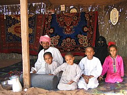A Bedouin family in Sharqiya Sands, Oman.