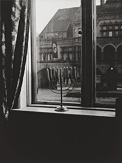 Chanukah Menorah opposite Nazi building in Kiel, Germany, December 1931.