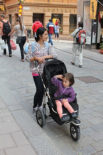 A child being pushed in a stroller