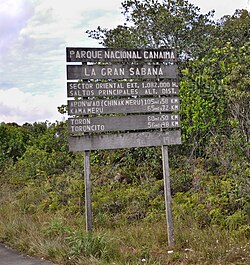 A rustic roadside sign