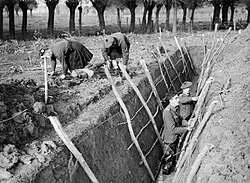 Men of the 1st Battalion, Queen's Own Cameron Highlanders digging trenches at Aix, France, November 1939.