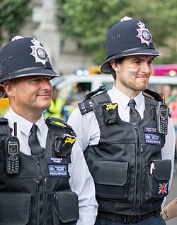 Metropolitan Police officers in 2019. The custodian helmet has been called "an iconic symbol of British policing".[156]