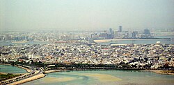 The cities of Muharraq (foreground) and Manama (background)