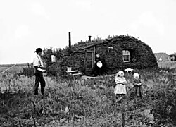Norwegian settlers in front of their sod house in North Dakota in 1898