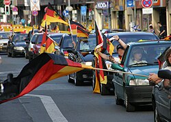 Fans in celebratory motorcade
