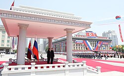 Kim and Vladimir Putin watching a military parade in Pyongyang.