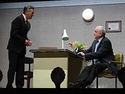 "Argument Clinic" sketch with Palin (standing) at Monty Python Live (Mostly), in 2014