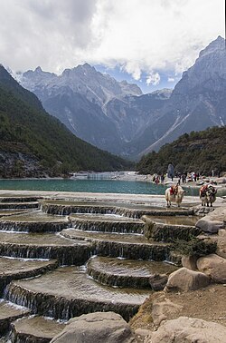 Baishui River with Jade Dragon Snow Mountain in background