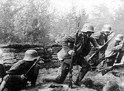 German Stoßtruppen (stormtroopers) rising from trenches to attack, equipped with satchel-bags of grenades