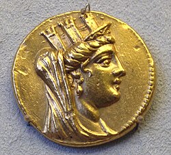 A golden coin depicting Tyche with a mural crown. Found at Tyre, currently in the Bode Museum, Berlin.