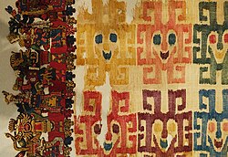 Detail of "the Paracas Textile" showing part of the cross-knit looped edge and some of the rayed heads in the middle woven web.
