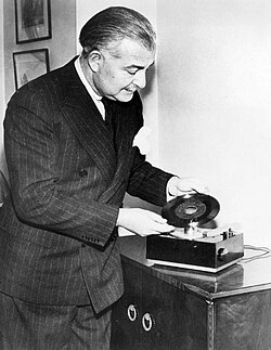 Boston Pops conductor Arthur Fiedler demonstrating the new RCA Victor 45 rpm player and record in February 1949