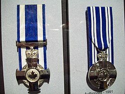 Canada's two meritorious service decorations, (left to right) the Meritorious Service Cross (military division) and the Meritorious Service Medal (civil division)