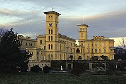 Osborne House on the Isle of Wight, England, built between 1845 and 1851. It exhibits three typical Italianate features: a prominently bracketed cornice, towers based on Italian campanili and belvederes, and adjoining arched windows.[1]