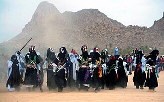 Sebiba[nb 3] Tuareg festival in Djanet, Algeria. The celebrants brandish takouba swords.
