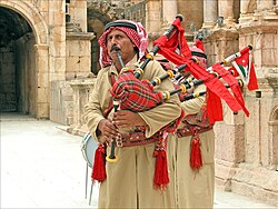 Jordanian folklore band playing bagpipes in Jerash
