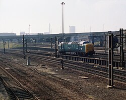 A Deltic at Belle Isle in the 1970s. Lines through the multiple arched bridge behind led to Top Shed and Kings Cross Goods yard