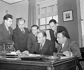 CIO leaders listen to President Roosevelt's Day of Infamy speech before pledging support to the war effort, December 12, 1941Left to right: Austin Hogan, TWU; Michael Quill, TWU; Ben Gold, IFLWU; Joseph Curran, NMU; Harry Bridges, ILWU, Morris Muster, UFWA