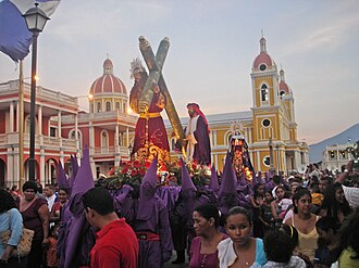 Lent observers, including a confraternity of penitents, carrying out a street procession during Holy Week, in Granada, Nicaragua. The violet colour is often associated with penance and detachment. Similar Christian penitential practice is seen in other Christian countries, sometimes associated with fasting.[39]