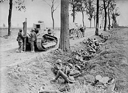 Canadian troops shelter in a ditch along the Arras-Cambrai road