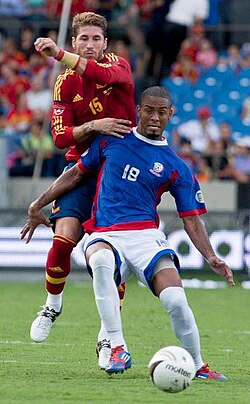 Ramos (in red) in action for Spain in a game against Puerto Rico.
