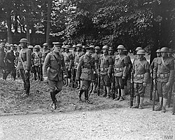 British King George V and General John J. Pershing inspecting men from every unit of the U.S. 33rd Division which took part in the fighting at Hamel on 4 July and Chipilly on 8 August. Molliens, 12 August 1918.