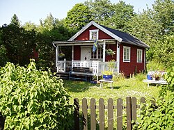 Farmhouses in Småland are typically red with white corners.
