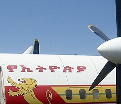 The Ethiopic (or Geʽez) writing system is visible on the side of this Ethiopian Airlines Fokker 50: it reads "Ethiopia's": የኢትዮጵያ ye-ʾityop̣p̣ya.