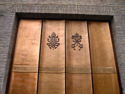Recently constructed entrance to Vatican City, with inscription "Benedictus XVI Pont(ifex) Max(imus) Anno Domini MMV Pont(ificatus) I.", i.e., "Benedict XVI, Pontifex Maximus, in the year of Our Lord 2005, the first year of his pontificate."