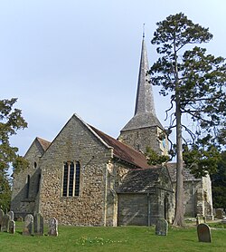 From left to right, the north aisle, west end of the nave, southwest porch and south transept are visible.