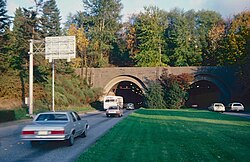 The former west portal in 1982. This afternoon-rush-hour view shows the reversible lanes in use, with one westbound lane and three eastbound.