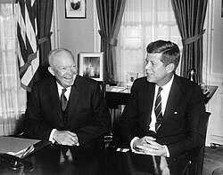 Eisenhower sharing a light moment with President-elect John F. Kennedy during their meeting in the Oval Office at White House