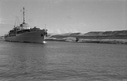 A ship sailing down the Suez Canal in 1955