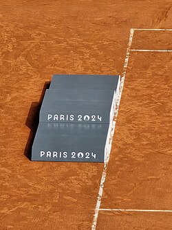 A 2024 Summer Olympics podium at the Stade Roland Garros