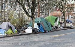 Tent camps set up on the sidewalk in the Lloyd District neighborhood