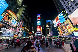 Times Square in Midtown Manhattan, hub of the Broadway's theater district, a media center, and one of the world's busiest pedestrian intersections