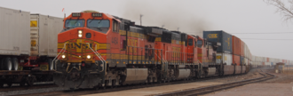 GE Dash 9-44CW 4464 leads a container train through Winslow, Arizona, in the rain on the BNSF Southern Transcon in Northern Arizona.