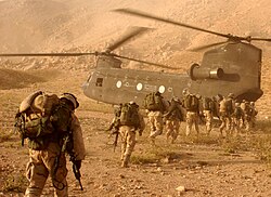 US Army Soldiers board a helicopter in Zabul province, 2003