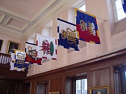 Banners bearing heraldic badges of several officers of arms at the College of Arms in London