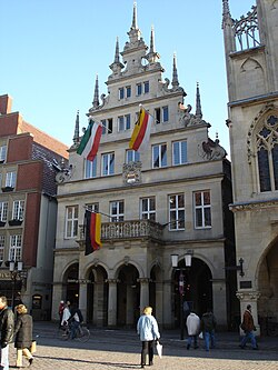 The Stadtweinhaus in Münster with banners displayed in mourning (note the black ribbons atop each staff) after the death of former German president Johannes Rau in 2006