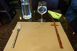 Forks and chopsticks in a Vietnamese restaurant in France