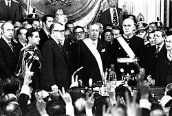 Cámpora takes the oath as President of Argentina in 1973. The then-president of Chile, Salvador Allende, can be seen over Cámpora's right shoulder.